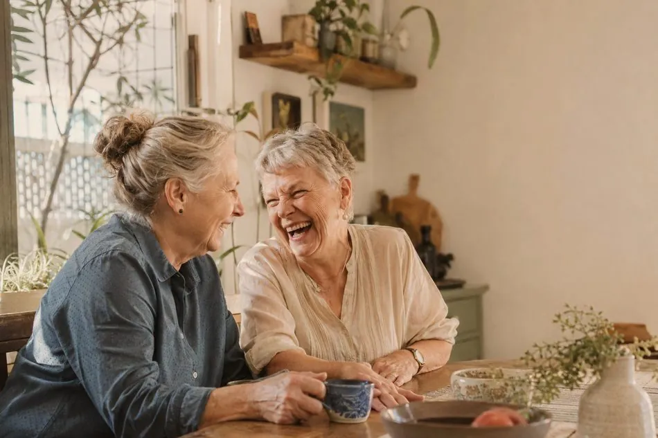Two women laughing together