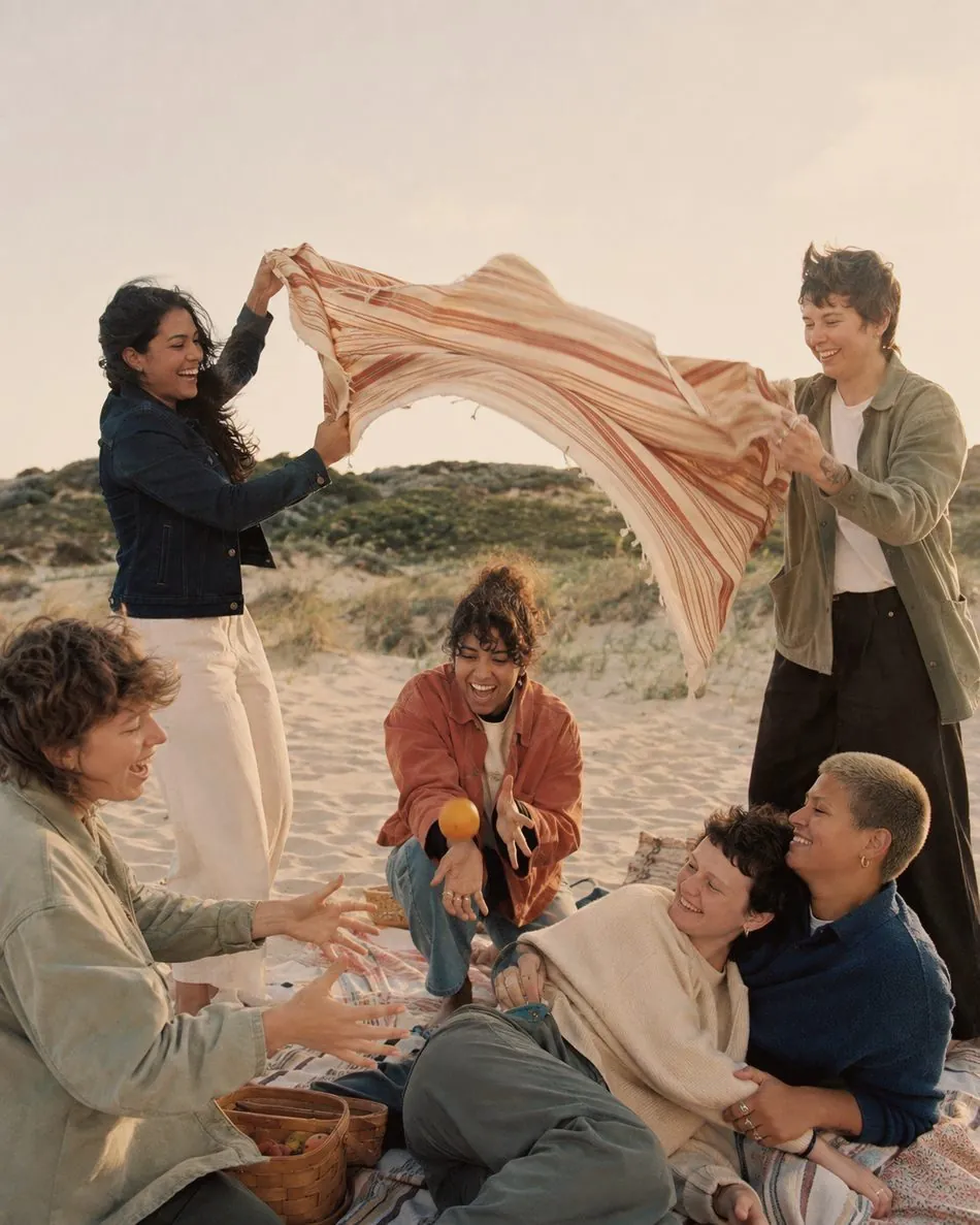 Chosen family gathered on the beach